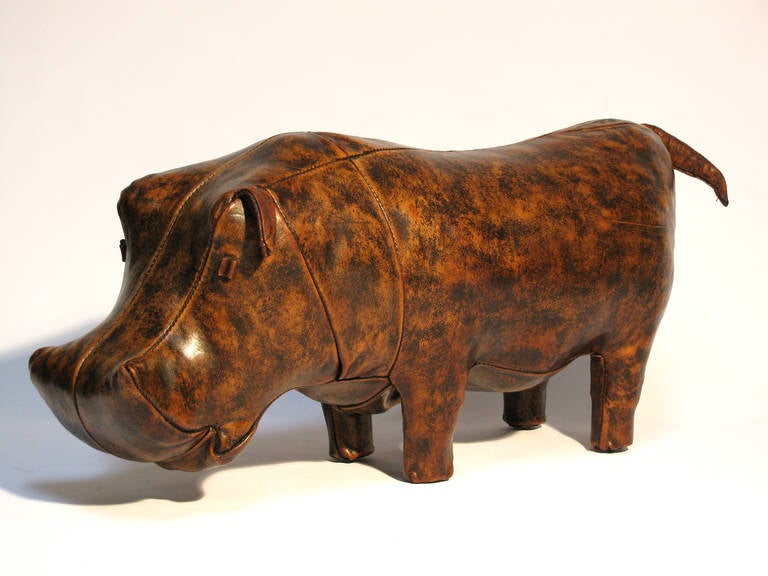 A large vintage leather hippo ottoman designed by Dimitri Omersa, manufactured by Omersa and Company and retailed by the Abercrombie & Fitch Company.