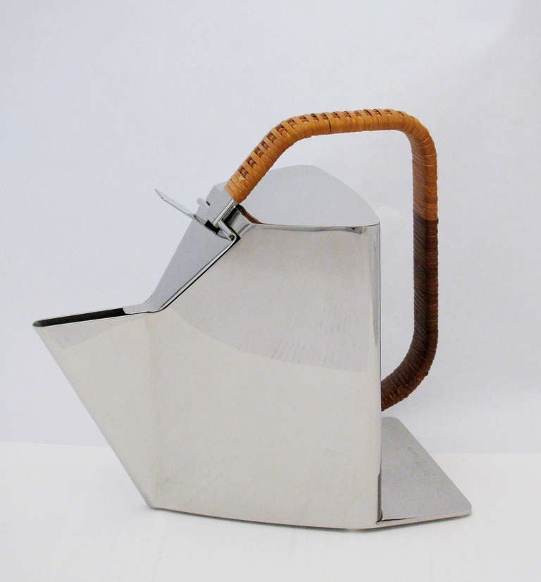 A rare polished steel kettle with cane-wrapped handle by Alessi, designed in 1987 by Richard Sapper. The Epitome of Modernism. Marked at base; Officina Alessi, Italy, model number 950120. No longer in production.