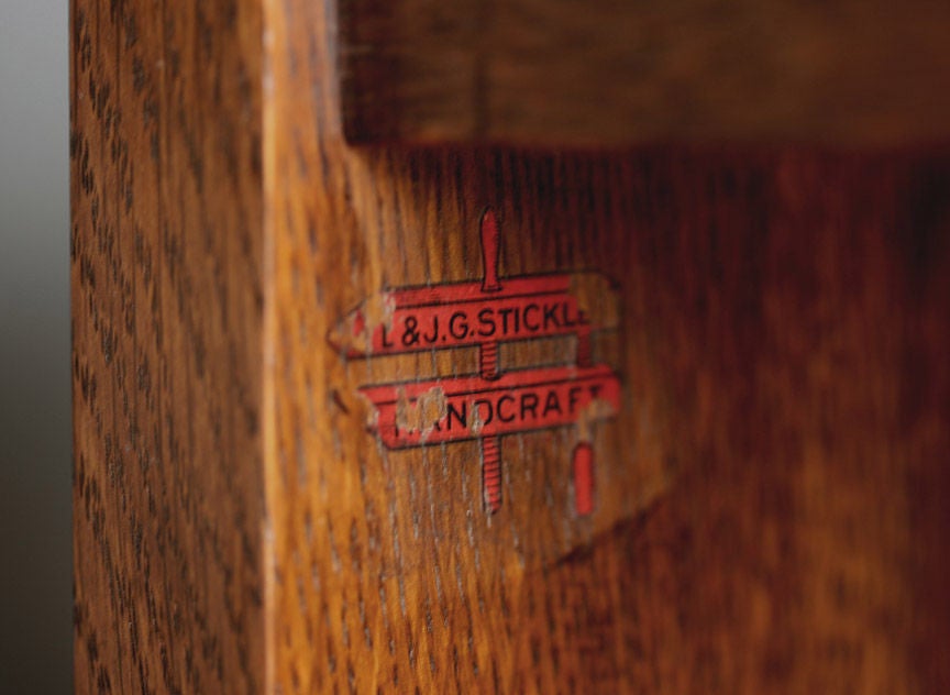 An elegantly simple, useful example of American Arts & Crafts design.<br />
<br />
Signed with red decal under the top shelf, on the inside  <br />
upright.<br />
<br />
Model No. 47 <br />
<br />
Four shelves above an arched toe board,  <br