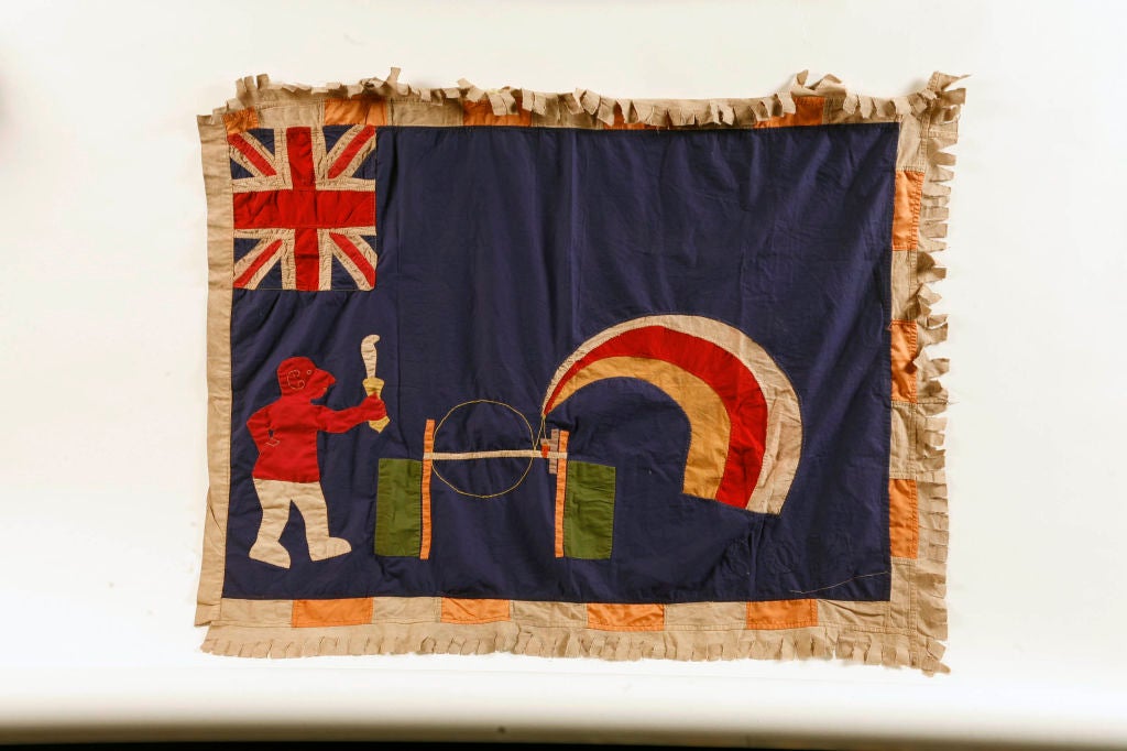 These appliqued patchwork banners combine the tradition of communication by proverb with military pomp and display.<br />
<br />
British Colonial Ghana period.<br />
<br />
Interesting iconography.  Phonograph?