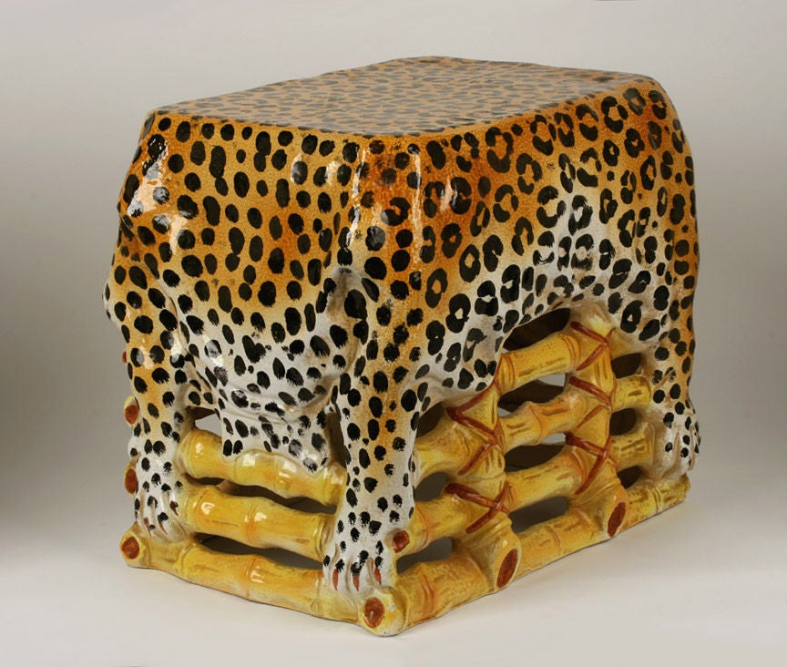 Whimsical hand painted leopard / cheetah hide on a bound bamboo table. 
Substantial
Incised 