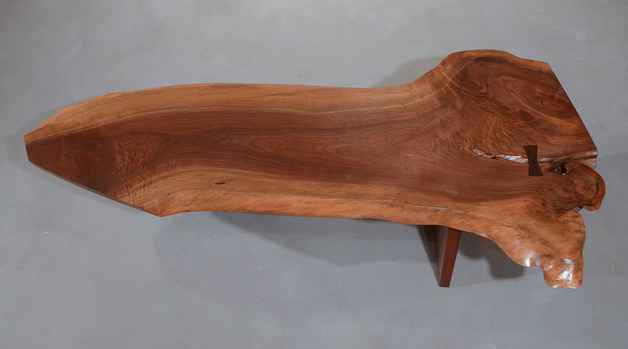 Highly figured and dramatic free form top of American black walnut with one rosewood butterfly.