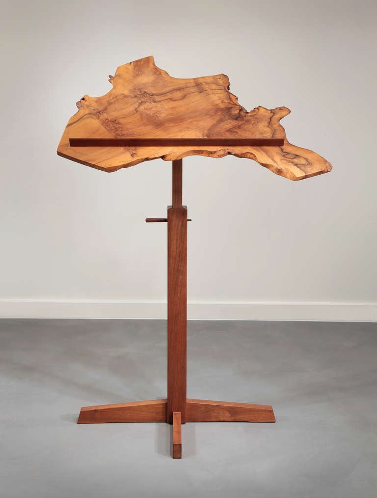 Unique design employing a dramatic piece of English walnut.  This custom design, based on his music stands, was made for the clients in order to have a rotating display of Japanese woodcuts.  Adjustable height, so it can also be used as a music