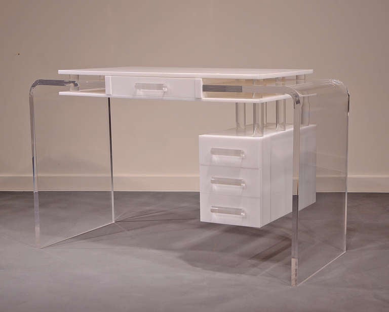 Stunning design - radius corners, clear and white lucite desk from the 1970's.  In the style of Vladimir Kagan.