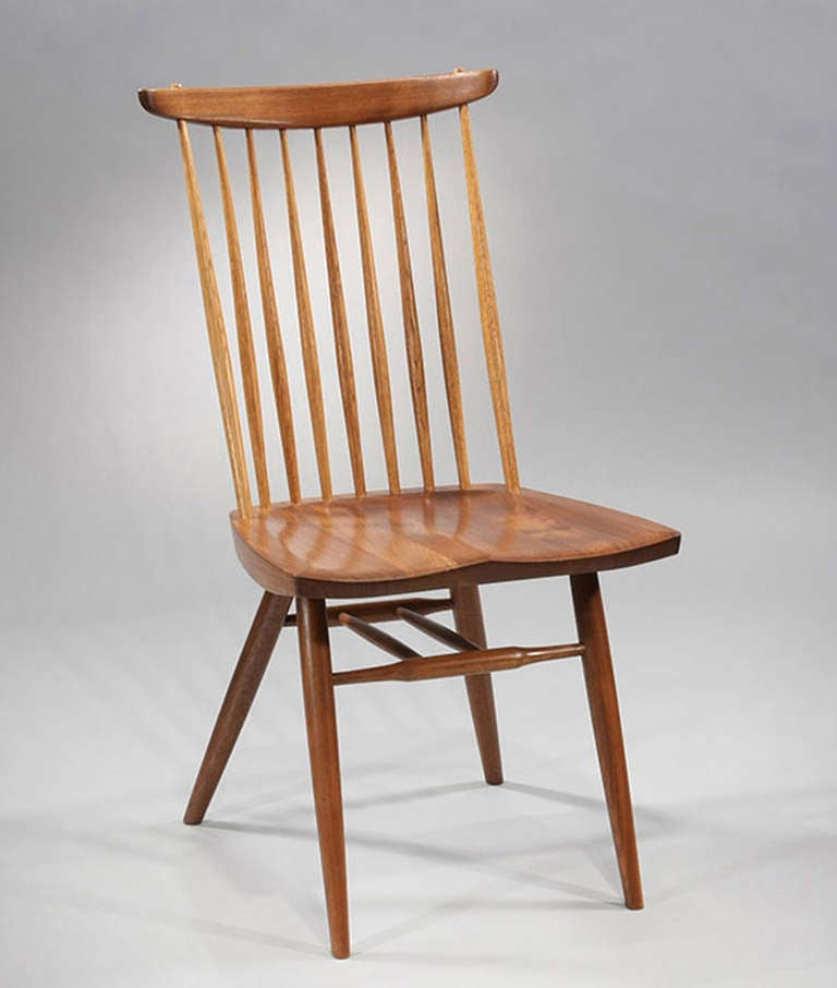 Classic windsor-style chair by Nakashima - American black walnut with hickory spindles.  Available individually or in sets.