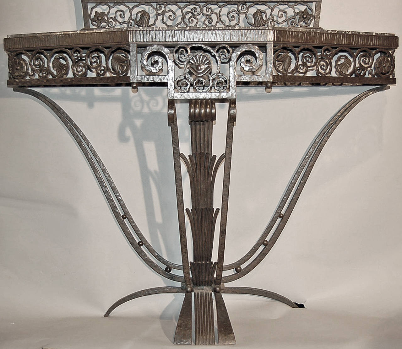 Unique, signed piece by Paul Kiss, one of the most renowned masters of French Art Deco Ironwork. Hand wrought iron console and matching mirror that was long lost in a private Philadelphia collection. Originally purchased at Wanamaker’s in