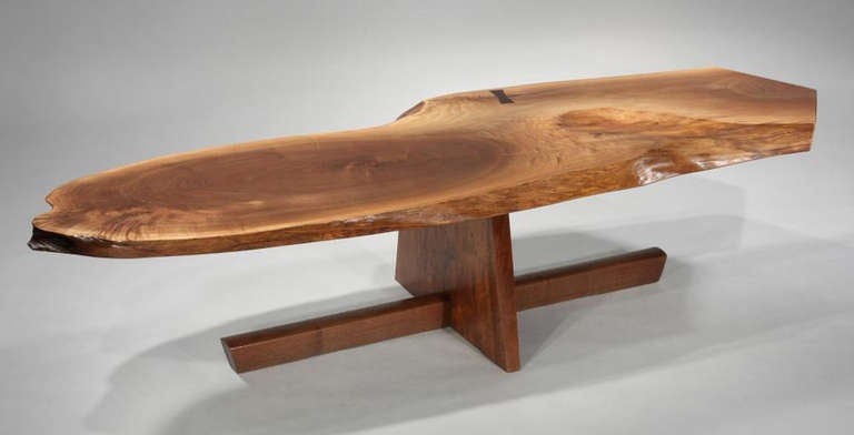 Dramatic free-form American black walnut coffee table with rosewood butterfly