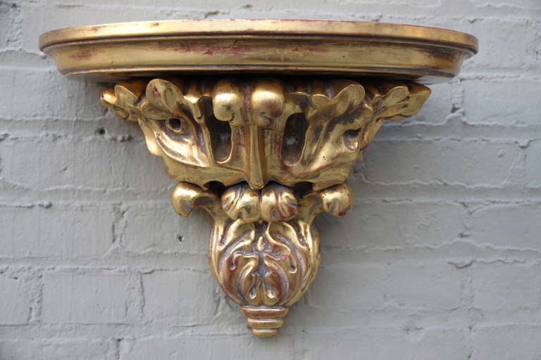 Pair of Italian carved 22K giltwood wall brackets.