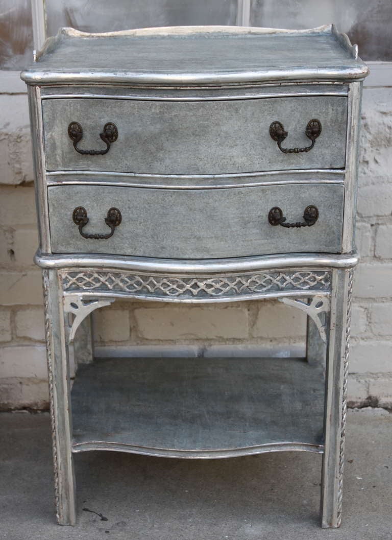 Pair of English painted & silver gilt side tables with two drawers and bottom shelf. Brass hardware.