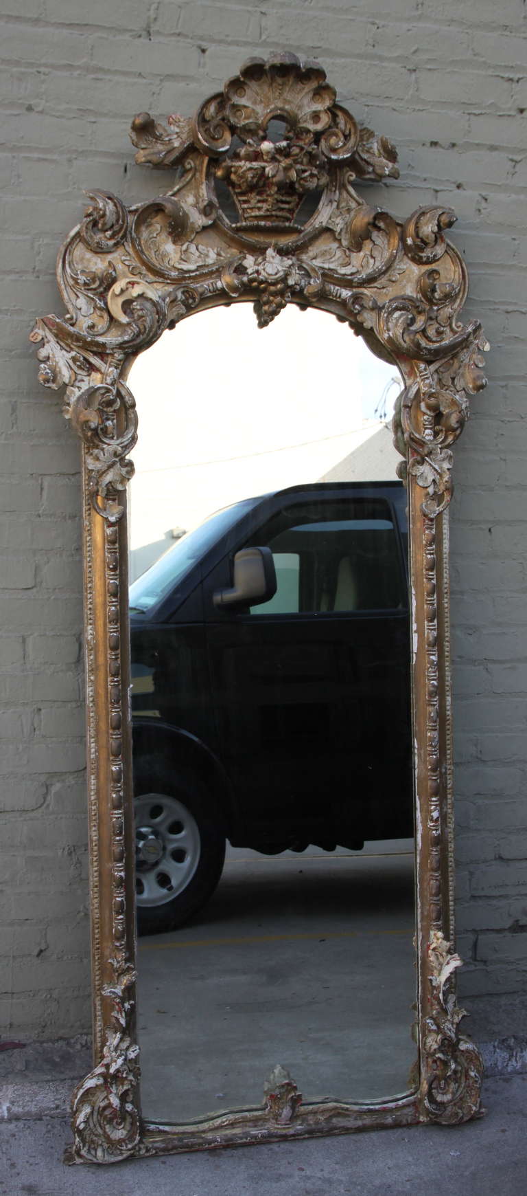 19th century Italian gold gilt mirror with distressed finish.