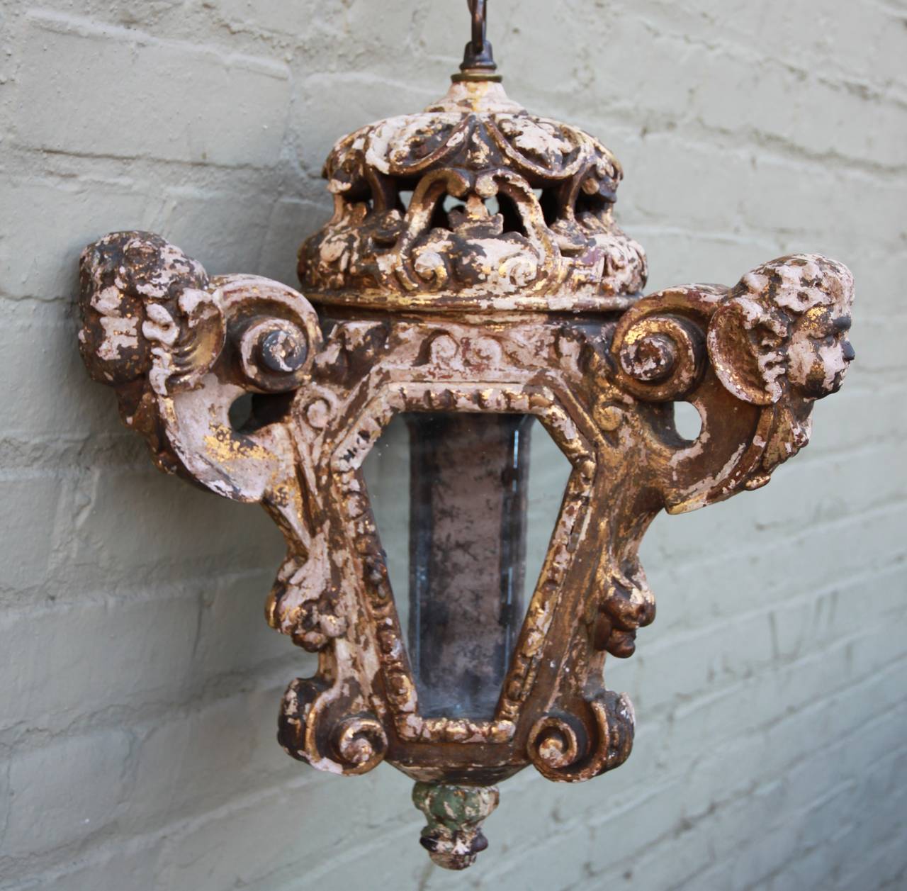 Pair of Italian Baroque style cherub lanterns with chain and canopy. Newly rewired and in working condition.