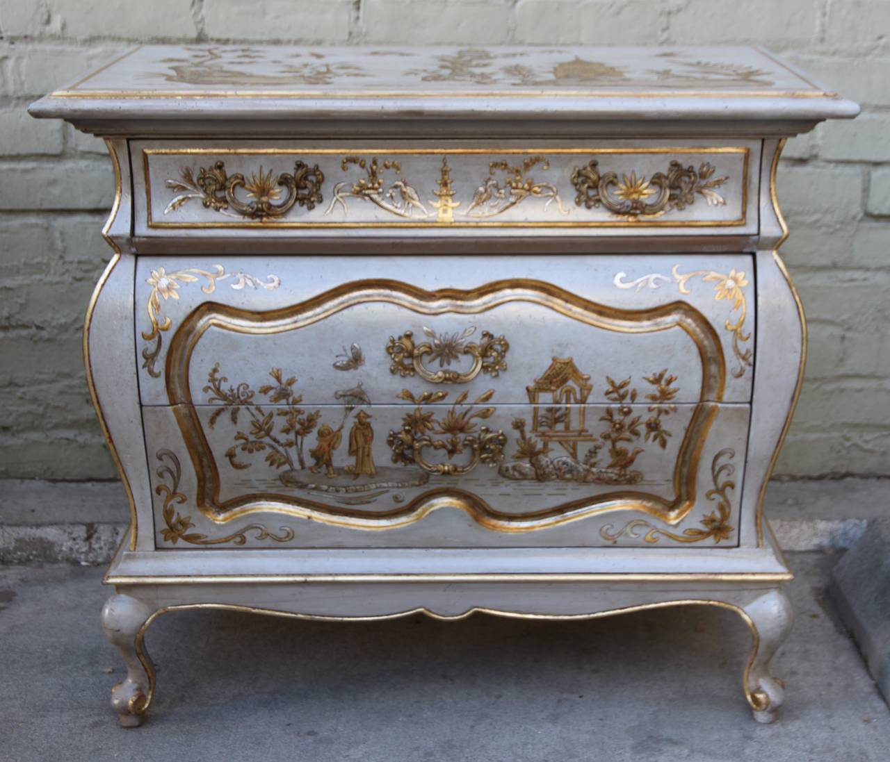 Pair of French chinoiserie painted chests standing on four cabriole legs.