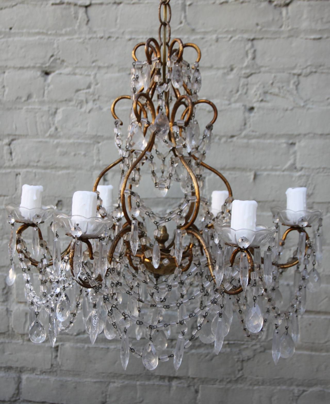 Six-light crystal macaroni beaded chandelier with crystal drops throughout. Newly wired with wax candle covers and ready to install.