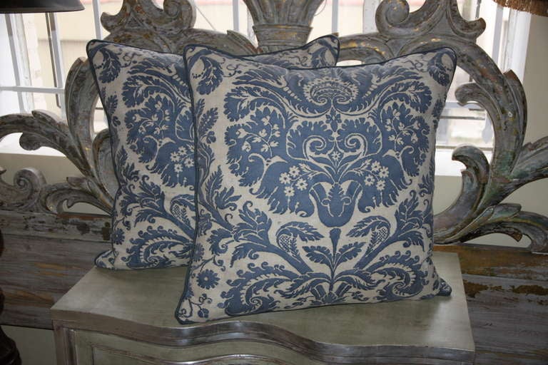 Pair of authentic vintage blue & white Fortuny pillows with blue linen backs and self welt detail. Down inserts.