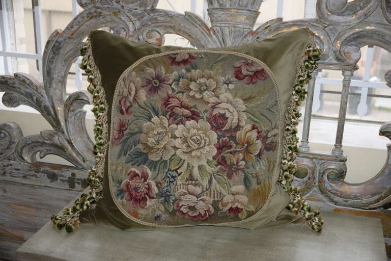 Pair of French Aubusson textile pillows with olive colored background and Belgium linen backs. Green silk tassel trim at sides.  Down filled inserts.