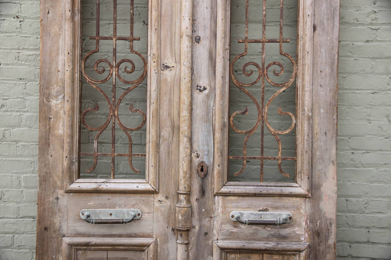 Pair of Monumental French Doors with Iron Grates In Distressed Condition In Los Angeles, CA