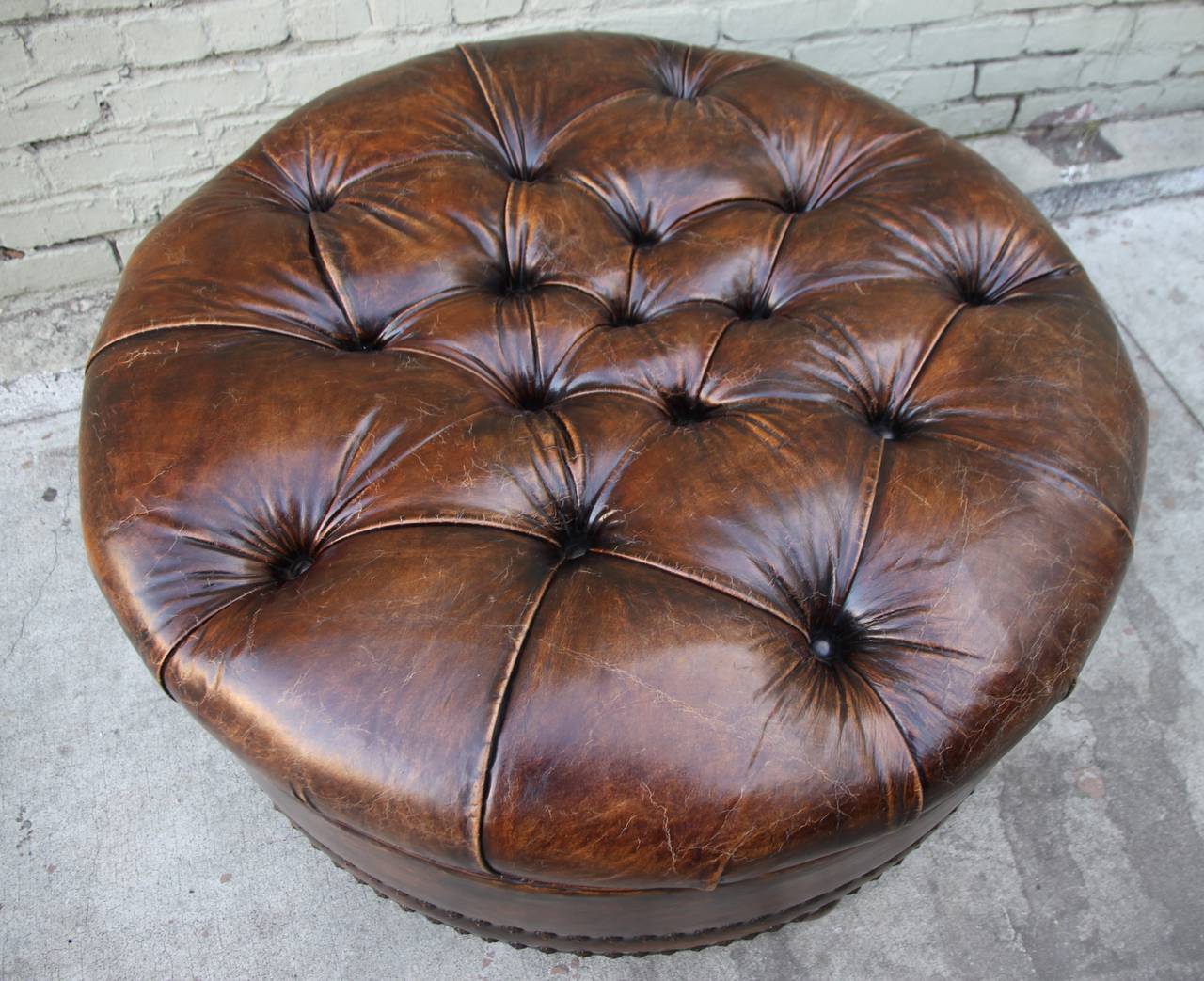 round leather ottoman tufted
