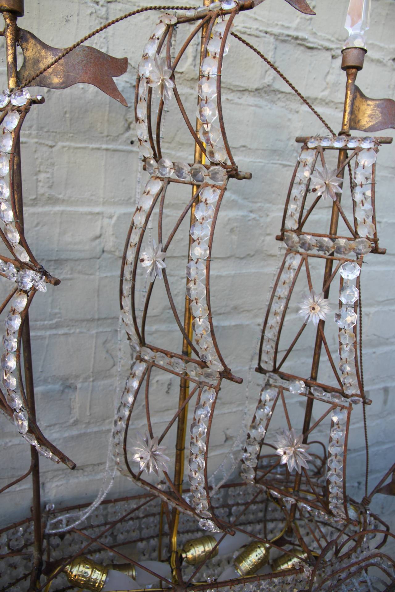 Unique crystal beaded and brass ship chandelier with life boats and anchors.