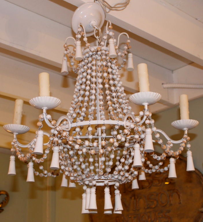 Carved painted 6-light Italian beaded chandelier with wood tassels.  The wiring is good and the chandelier is ready to be installed.