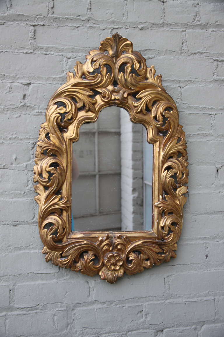19th century Italian gilt wood mirror with original glass.