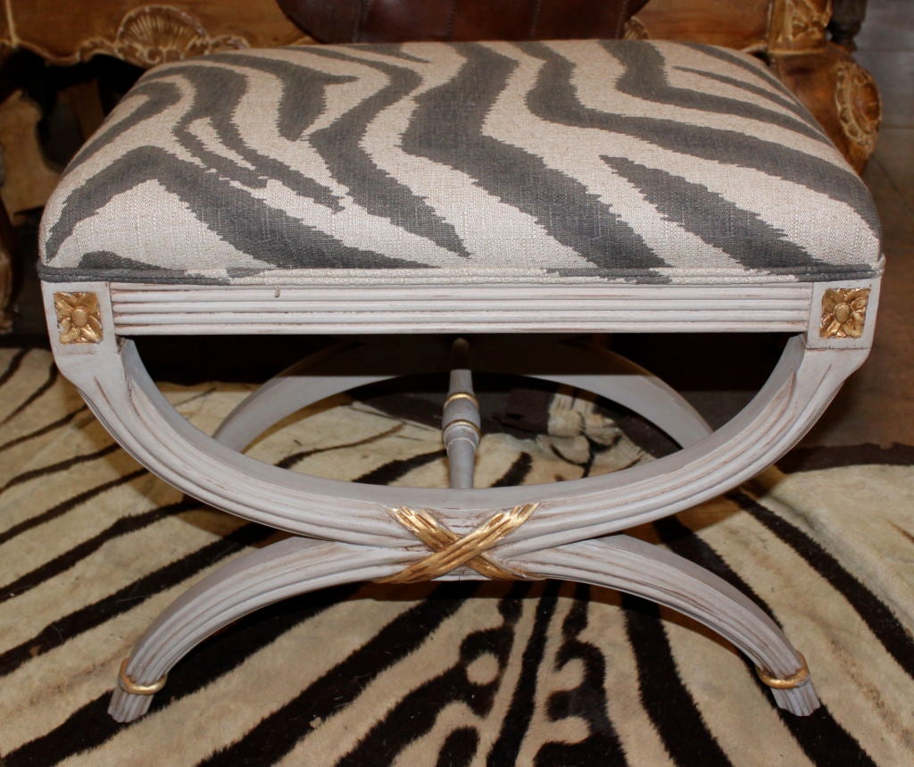 Pair of Italian Painted & Parcel Gilt Stools with Zebra linen upholstery.