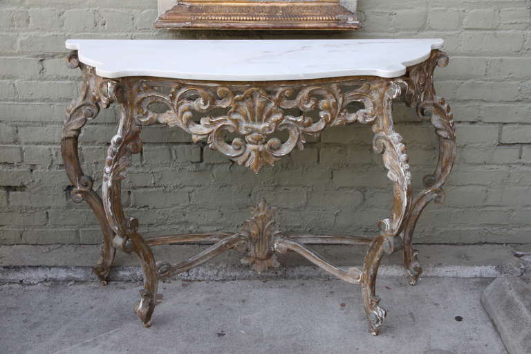 Italian carved painted & parcel gilt console with white marble top.