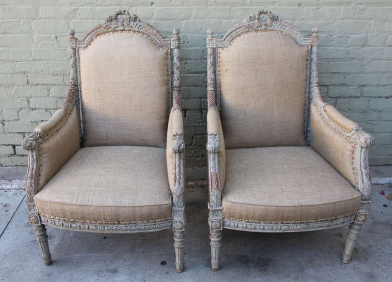 19th century French painted armchairs that have been newly upholstered in burlap and finished with the original nailhead trim detail. Tight seat, tight back.