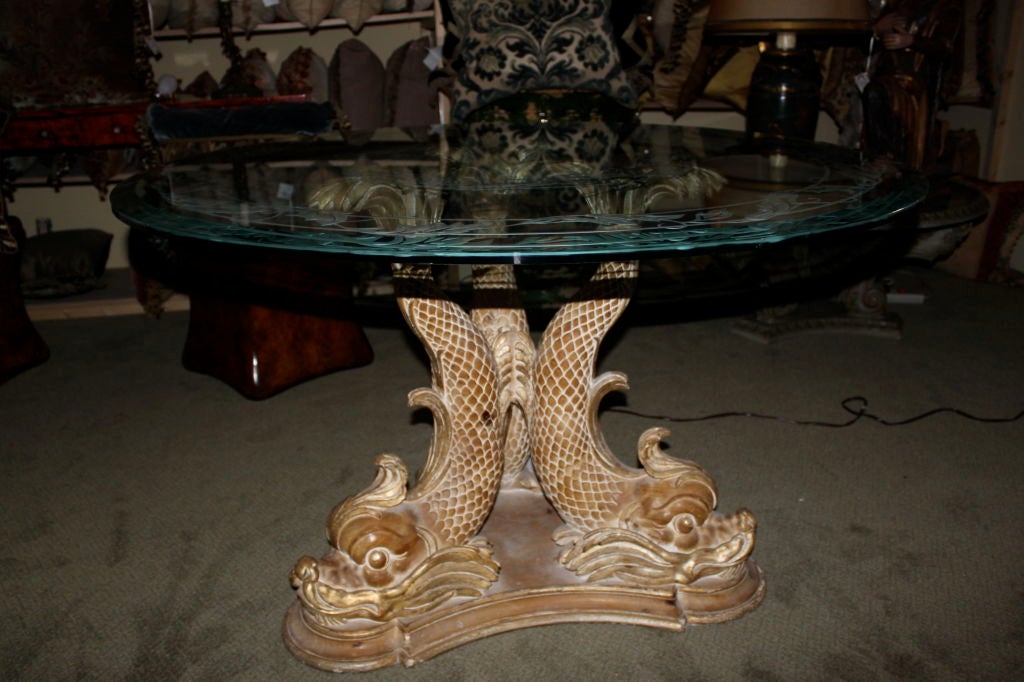 Carved Italian Dolphin pedestal table with etched glass top.