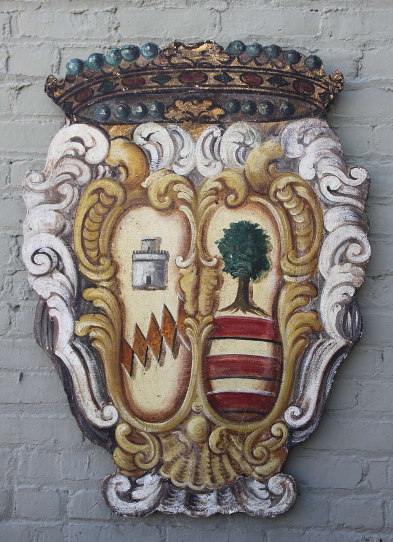 19th century painted family crest on canvas that was applied to a wood back.