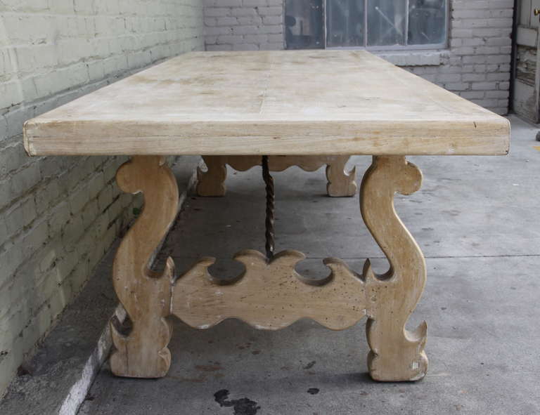 Spanish Dining Table with Iron Stretcher In Distressed Condition In Los Angeles, CA