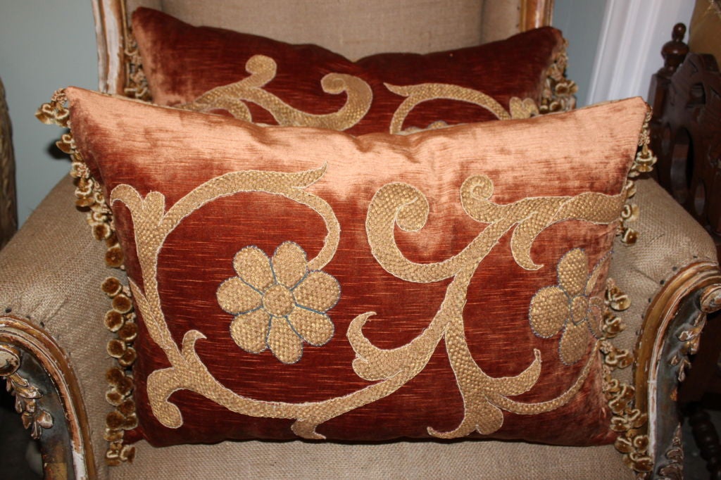 Pair of 19th c. Appliqued Pillows on linen velvet with tassel trim detail.
