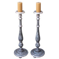 Pair of Italian Painted and Silver Gilt Carved Candlesticks