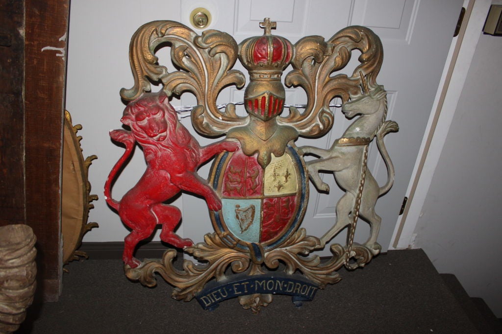 Large Italian Family Crest with lion and horse flanking the crest with acanthus leaves and crown with cross.