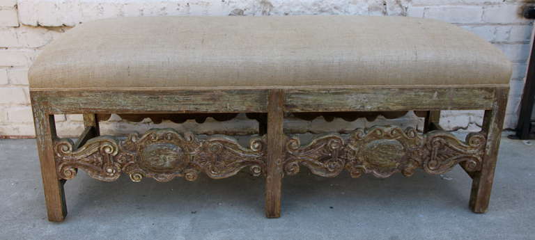 Spanish painted carved burlap upholstered bench with self cording.