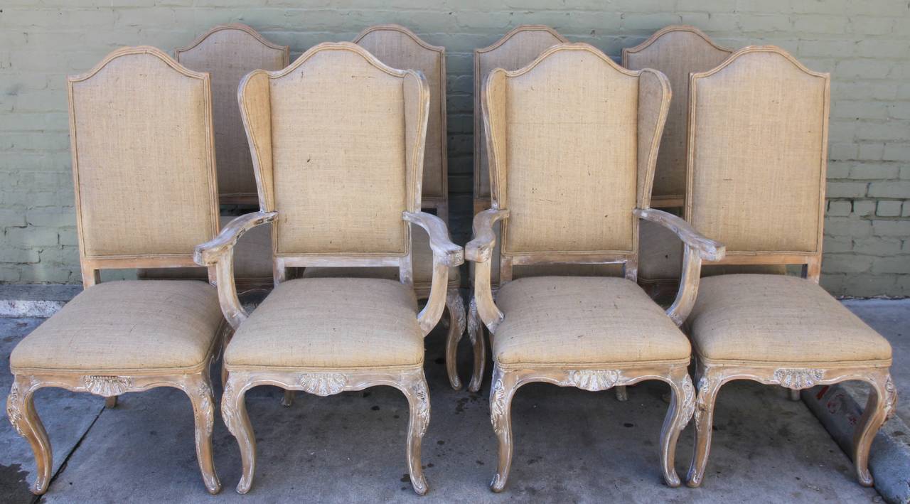 Set of (8) French white washed Louis XV style dining chairs newly upholstered in burlap textile with self cording.