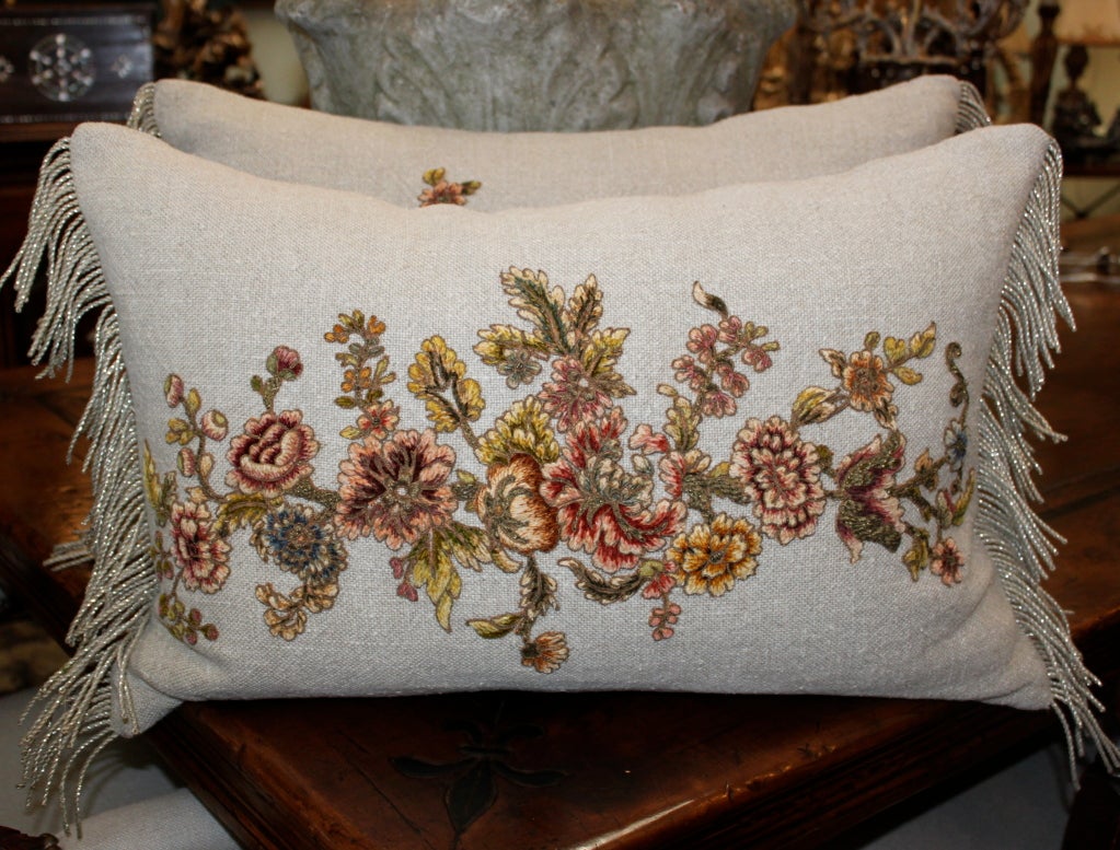 Pair of 19th century metallic & chenille embroidered and appliqued Belgium Linen pillows with antique silver trim detailing at sides.  Down & feather inserts.  These pillows are so beautiful! Please note that the appliques are slightly different.