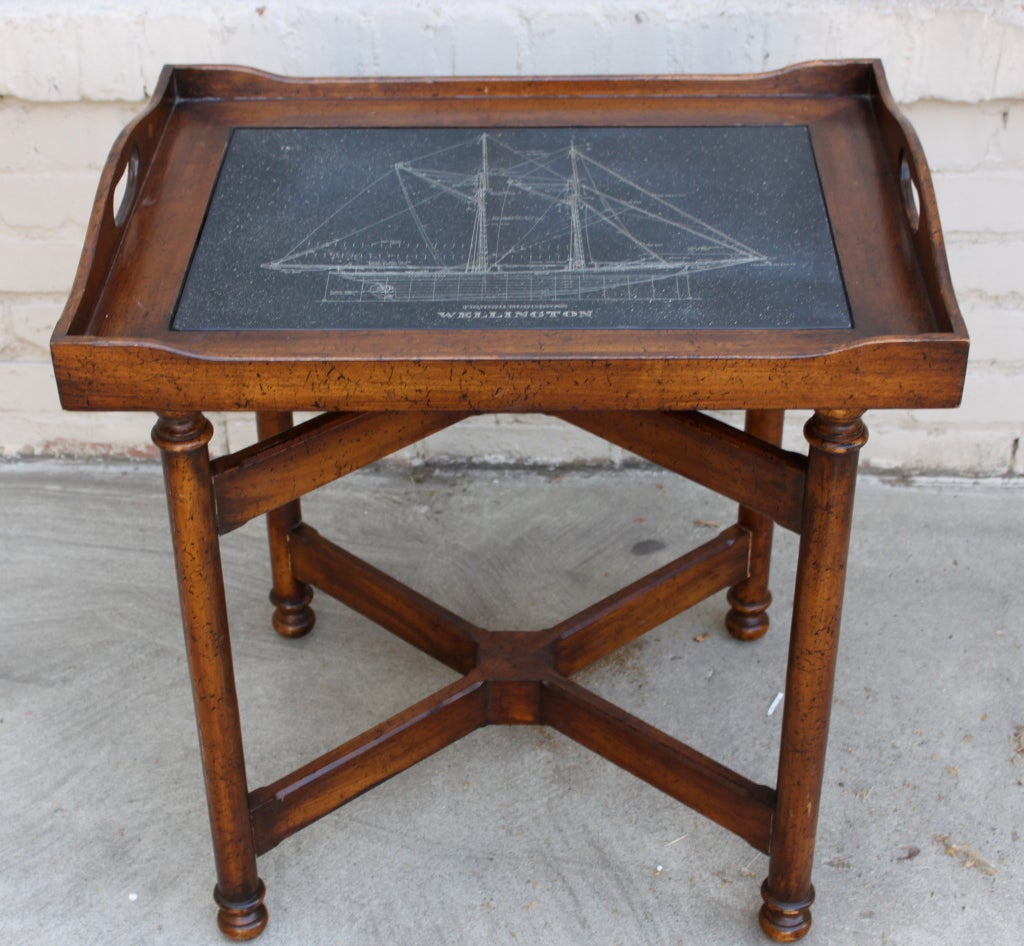 Vintage tray table with inset stone.  The stone has an etching depicting a ship 
