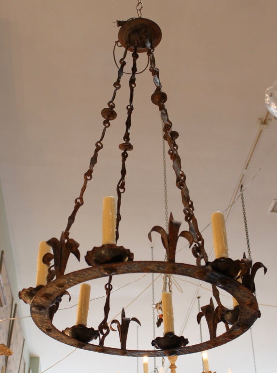 19th century six light wrought iron chandelier with amazing patina.  Newly wired and in working condition.