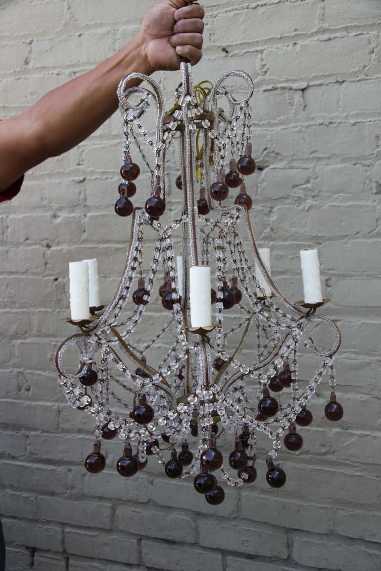 Italian macaroni crystal beaded six-light chandelier with amethyst colored drops.