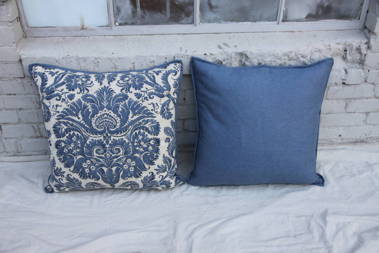 Pair of blue & white Fortuny pillows with blue linen back and self welt detail.  Down & feather inserts.