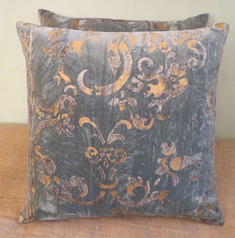 Pair of gold & silver stenciled blue velvet pillows with silk backs. Down inserts.
