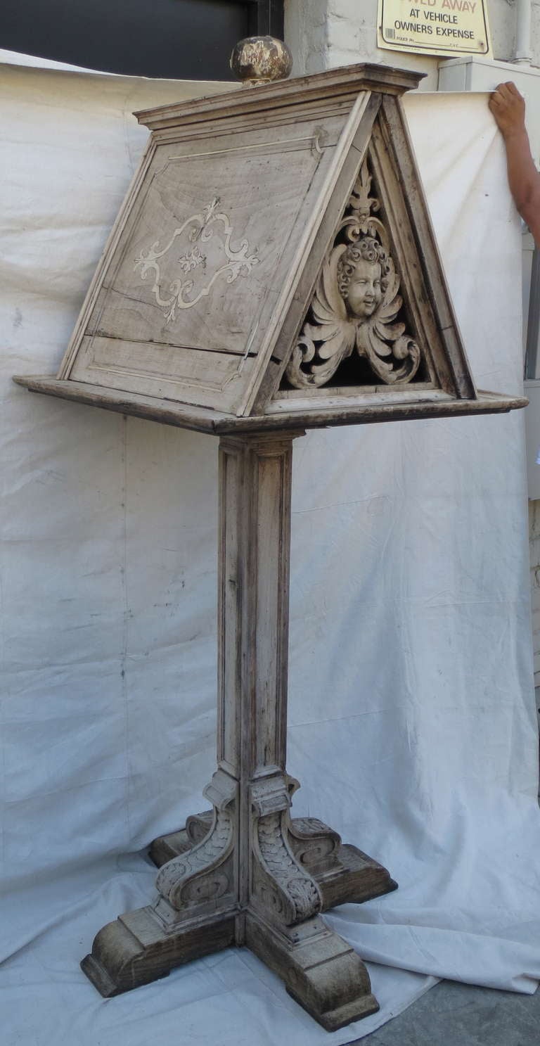 18th century carved Italian cherub face bookstand with inlay.
