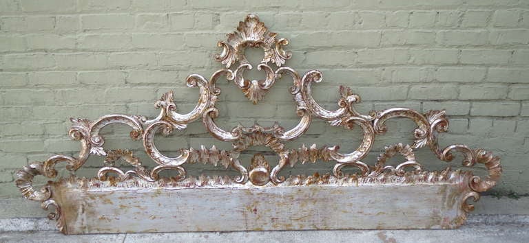 Italian carved silver leaf & painted headboard with carved scrolls throughout.