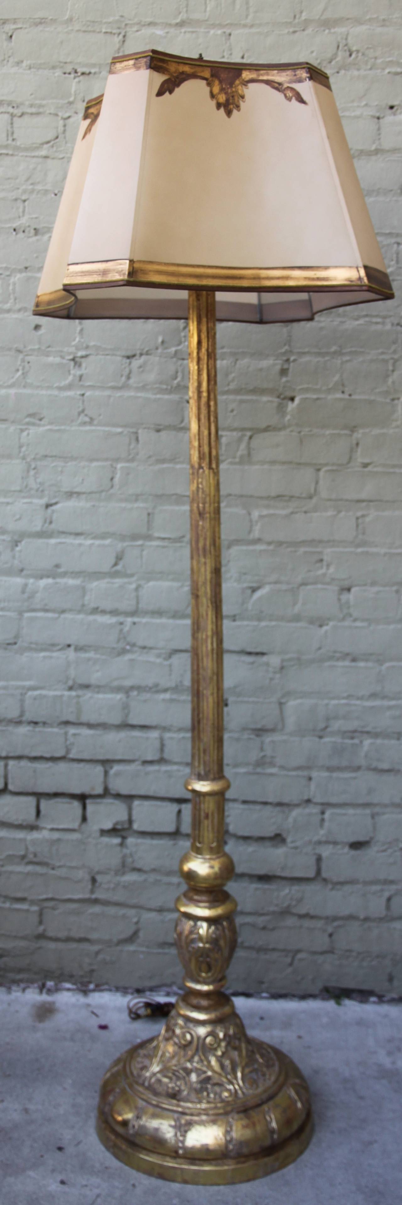 19th century Italian carved 22-karat giltwood standing lamp with a custom hand-painted parchment shade.