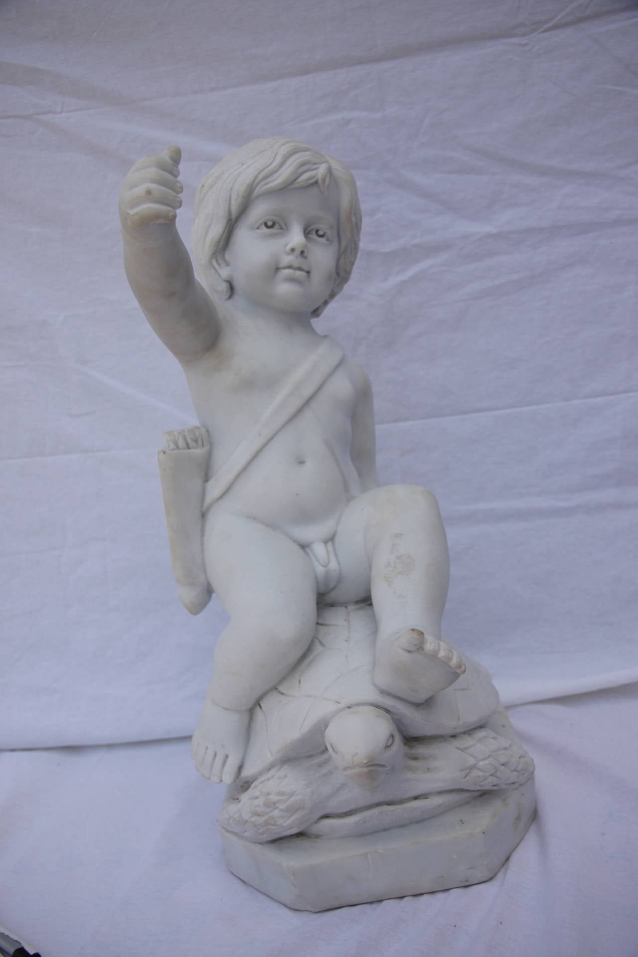 Charming set of four Carrara marble putti statues depicting 