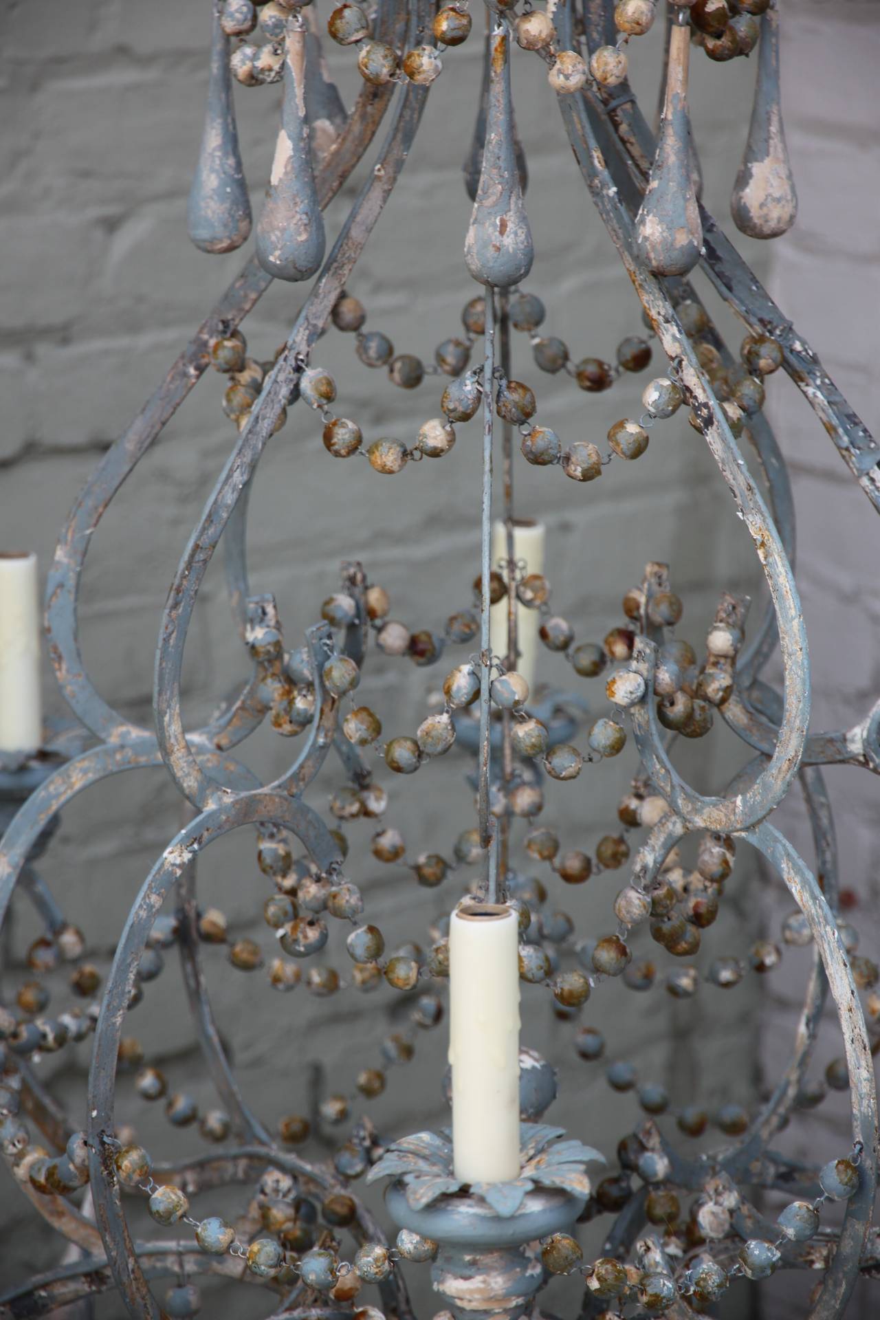 Iron and Wood Beaded Eight-Light Painted Chandelier In Distressed Condition In Los Angeles, CA