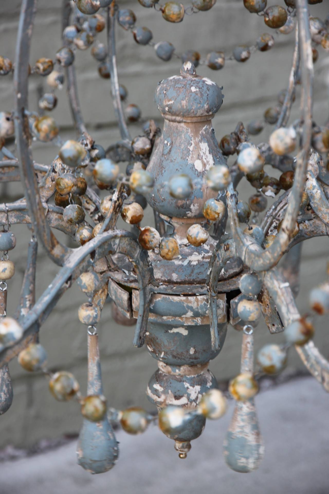 20th Century Iron and Wood Beaded Eight-Light Painted Chandelier