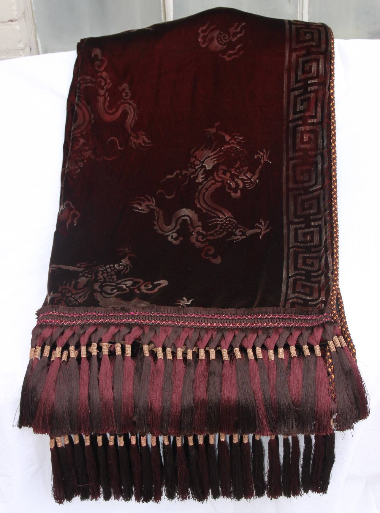 Custom merlot colored stenciled silk velvet throw with chinoiserie design and Greek key border.