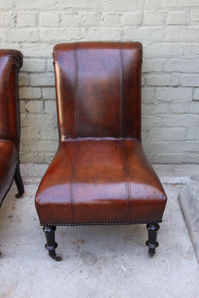 Other Pair of Leather Upholstered Side Chairs Standing on Casters