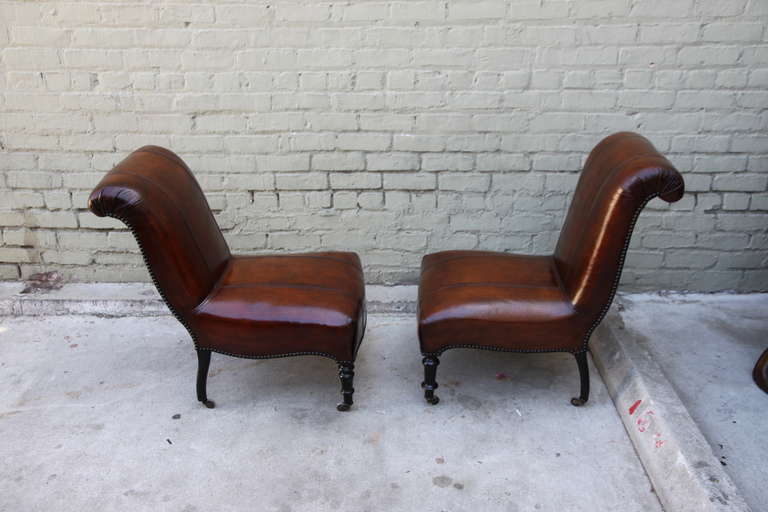 American Pair of Leather Upholstered Side Chairs Standing on Casters